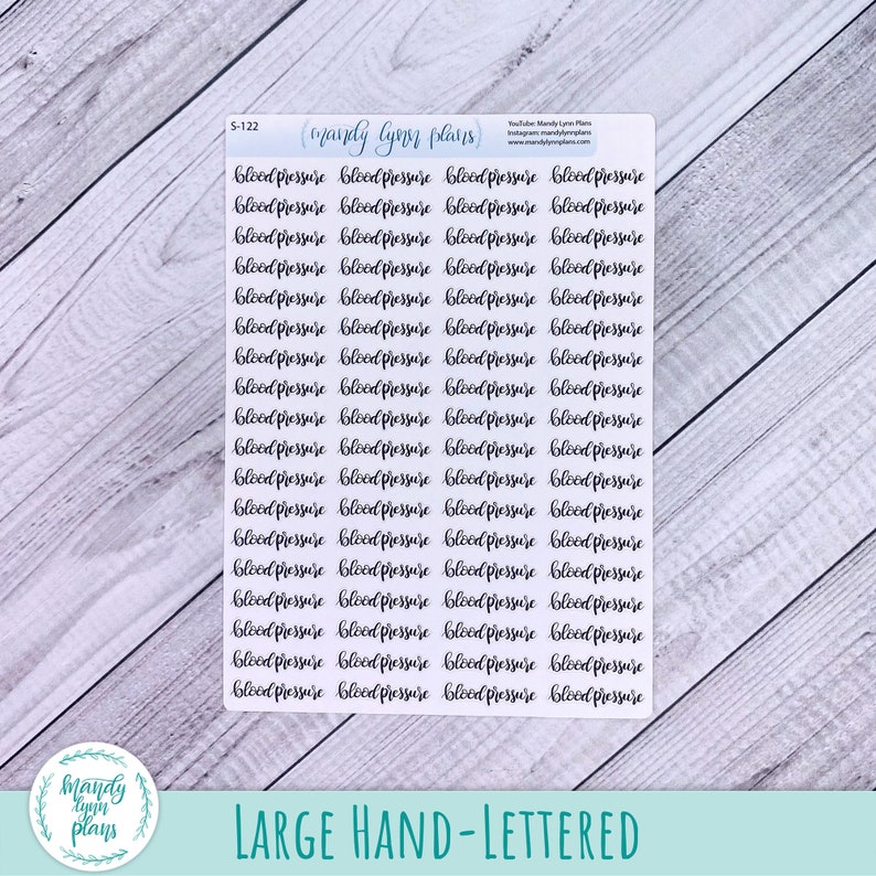 May include: A rectangular sticker sheet featuring multiple rows of the words blood pressure written in a black cursive script. The top of the sheet includes the text mandy lynn plans, the code S-122, and social media information in small print.