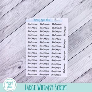 May include: A white sticker sheet featuring multiple rows of the text "blood pressure" printed in a black cursive script font. The top of the sheet includes the text "mandy lynn plans" and the code "W-122" along with social media icons and handles.