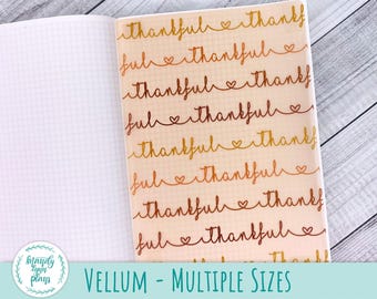 May include: Open notebook with grid paper and a vellum overlay. The vellum features the words "thankful" and "ful" in a repeating pattern with heart accents. The text "VELLUM - MULTIPLE SIZES" is at the bottom.