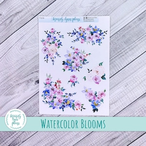 May include: Watercolour flower stickers with a light blue, pink and white colour scheme. The stickers feature various floral arrangements and are labelled "Watercolor Blooms".