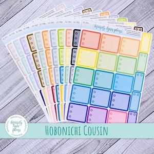 May include: A collection of colorful planner stickers with rectangular and circular designs. Each sticker sheet features a different color scheme, including shades of blue, green, pink, and yellow. The text "HOBONICHI COUSIN" is displayed at the bottom.
