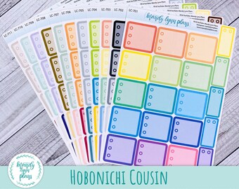 May include: A collection of colorful planner stickers with rectangular and circular designs. Each sticker sheet features a different color scheme, including shades of blue, green, pink, and yellow. The text "HOBONICHI COUSIN" is displayed at the bottom.
