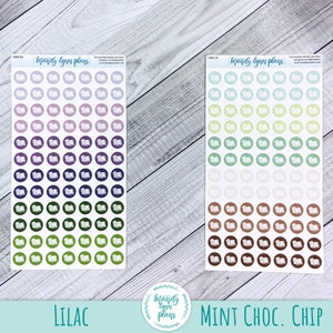 May include: Three sheets of stickers featuring a book icon design. The stickers are in three colour schemes: lilac, mint green, and brown. Each sheet has 6 rows of 7 stickers, for a total of 42 stickers per sheet. The text "Mandy Lynn Plays" is at the top of each sheet.
