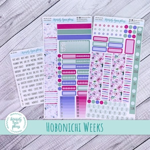 May include: A set of colourful planner stickers with floral designs and text that says "brandy lynn plays". The stickers are for use with a Hobonichi Weeks planner. The stickers include a variety of shapes, sizes, and colours, including pink, purple, blue, green, and white.