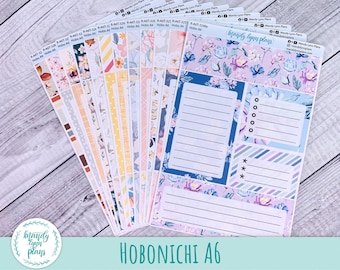 May include: A set of colorful floral patterned planner stickers for the Hobonichi A6 planner. The stickers include a variety of designs, including floral patterns, stripes, and polka dots. The stickers are perfect for adding a touch of personality to your planner.