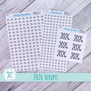 May include: White sticker sheets featuring the year "2026" in various fonts, alongside repeated smaller text of the same year. The brand name "mandy lynn plans" is also visible on the stickers.