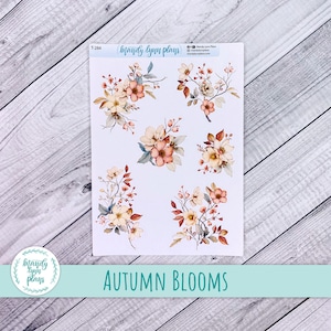 May include: A sheet of planner stickers featuring watercolour floral designs in shades of peach, cream, and brown. The stickers include various arrangements of autumn blooms. The text "Autumn Blooms" is displayed at the bottom.