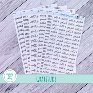 May include: A set of 10 sheets of clear stickers with the word "gratitude" written in black cursive script. The stickers are arranged in rows and columns on a white background. The word "gratitude" is repeated multiple times on each sheet.