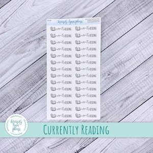May include: A sheet of clear stickers with 30 black and white illustrations of an open book with the text "currently reading". The stickers are designed for use in a planner or journal.