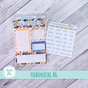 May include: Two planner sticker sheets with floral and geometric designs. One sheet says "November" and has lined sections. The other sheet has various labels like "Projects," "To Watch," and "Goals." The text "Hobonichi A6" is also visible.