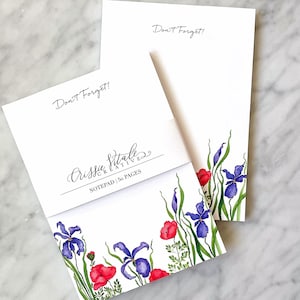 May include: A notepad with a floral design featuring red poppies and purple irises. The notepad has 50 pages and says "Don't Forget!" at the top. The notepad is from Crissie Creates.