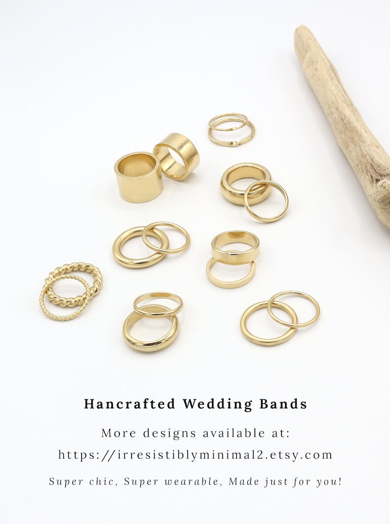 May include: A set of 10 gold-toned rings, including a variety of styles, such as thin bands, thicker bands, and a twisted band. The rings are arranged on a white surface. Hancrafted Wedding Bands. More designs available at: https://irresistiblyminimal2.etsy.com Super chic, Super wearable, Made just for you!