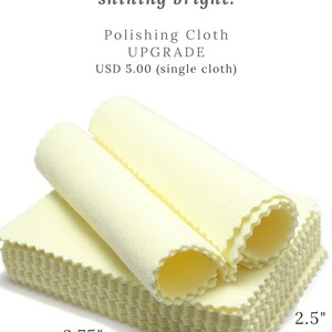 May include: A stack of yellow polishing cloths for jewellery. The cloths are 3.75 inches by 2.5 inches. Keep your jewellery shining bright! Polishing Cloth UPGRADE USD 5.00 (single cloth)