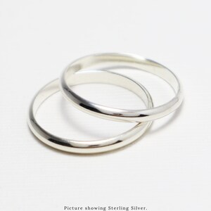 May include: Two silver rings, one slightly larger than the other, are stacked on top of each other.  Picture showing Sterling Silver. Available in 14K Gold-Filled, 14K Rose Gold-Filled, and Sterling Silver.