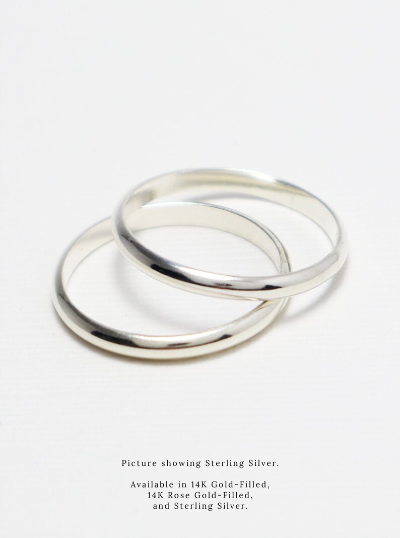 May include: Two silver rings, one slightly larger than the other, are stacked on top of each other.  Picture showing Sterling Silver. Available in 14K Gold-Filled, 14K Rose Gold-Filled, and Sterling Silver.