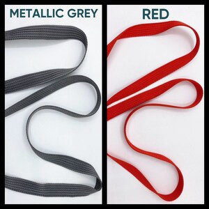 May include: Two strips of woven webbing material displayed side by side. The left strip is metallic grey and the right strip is red. Both strips feature a consistent, tight-knit texture and are arranged in loose, flowing loops against a white background.