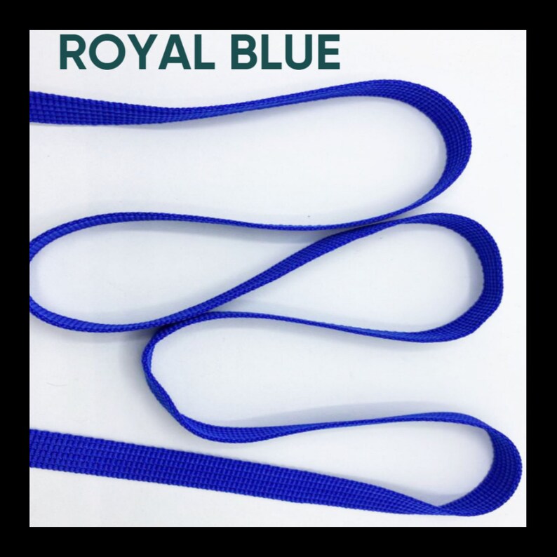 May include: A length of royal blue woven nylon webbing strap arranged in loose, overlapping loops. The material features a consistent, fine-textured grid pattern throughout its surface. The text ROYAL BLUE is printed in dark green at the top.