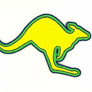 Può includere: Una silhouette di canguro gialla con un contorno verde e un contorno interno blu scuro.