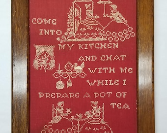 Muestrario de punto de cruz vintage, blanco sobre rojo