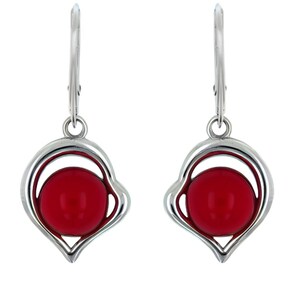 May include: A pair of silver drop earrings. Each earring has a heart-shaped frame with a bright red, round gemstone. The earrings have a lever-back closure. The design is simple yet elegant, suitable for various occasions. The gemstones are approximately 1 cm in diameter.