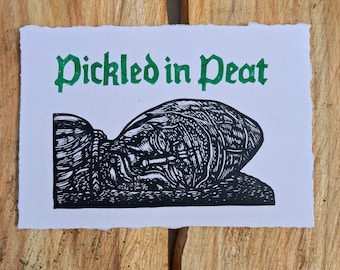 Pickled in peat lino print