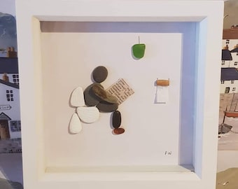 Pebble art 'Man on the loo' bathroom frame