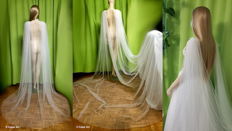 May include: Two white tulle capes, one 2 meters long and one 3 meters long, shown on mannequins. The capes are sheer and flowy, with a V-neckline.