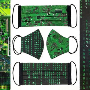 May include: Three black face masks with green and black circuit board patterns. The masks are pleated and have black elastic ear loops.