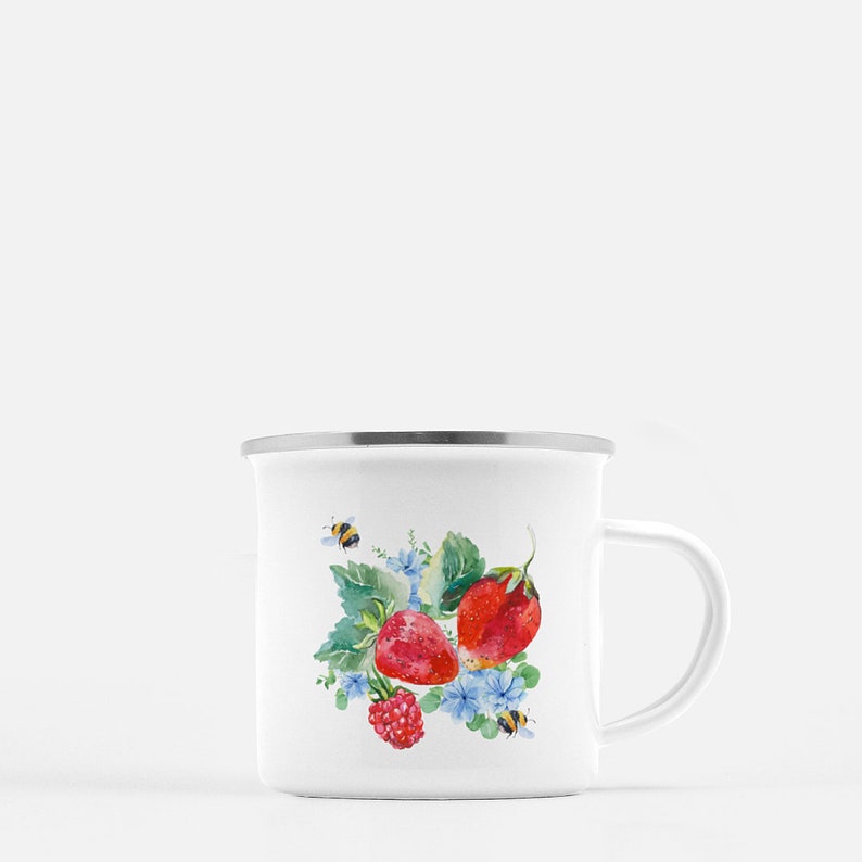 May include: White enamel mug featuring a watercolour design of strawberries, raspberries, and bees on a green leafy branch with blue flowers.