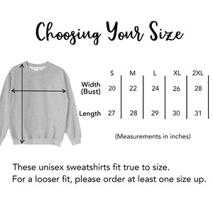 May include: Size chart for unisex sweatshirts with measurements in inches for width (bust) and length. Sizes range from S to 3XL.  "Choosing Your Size" is written at the top of the chart.  "These unisex sweatshirts fit true to size. For a looser fit, please order at least one size up." is written at the bottom of the chart.
