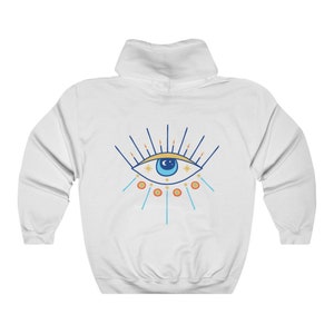 May include: White hooded sweatshirt with a blue eye with a yellow iris and white stars around it. The eye is surrounded by blue and orange rays.