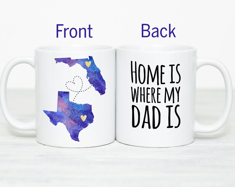 May include: White ceramic coffee mug with a watercolor design of Texas and Florida with a dotted line connecting the two states. The back of the mug reads "Home is where my Dad is".