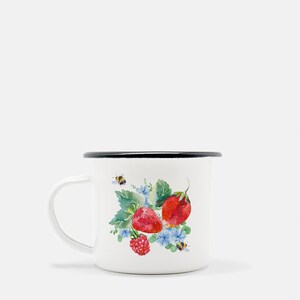 May include: White enamel mug with a black rim featuring a watercolour illustration of strawberries, raspberries, and bees on a green leafy background.
