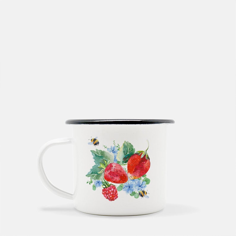 May include: White enamel mug with a black rim featuring a watercolour illustration of strawberries, raspberries, and bees on a green leafy background.