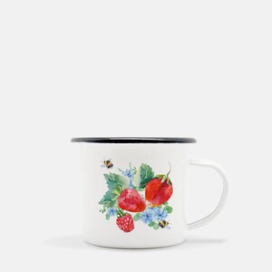 May include: White enamel mug with a black rim and handle. The mug features a watercolour illustration of strawberries, raspberries, and bees on a white background.