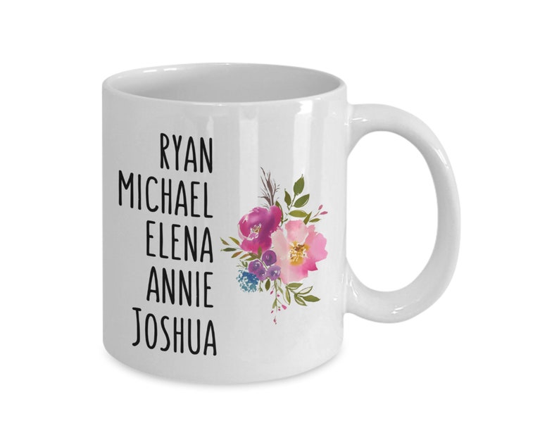 May include: White ceramic coffee mug with a floral design and the names Ryan, Michael, Elena, Annie, and Joshua printed in black.