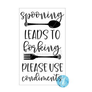 May include: Black and white sign with the text "Spooning leads to forking. Please use condiments."  A spoon and fork are pictured above the text.