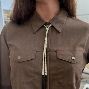 Front Adjusting Tila Bead Bolo with Fringe - speckled ivory & transparent brown