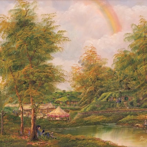 May include: An oil painting depicts a serene landscape with lush green trees, a calm river, and rolling hills. Hobbit-hole dwellings are nestled into the hills. A rainbow arches across the sky, adding a touch of fantasy.