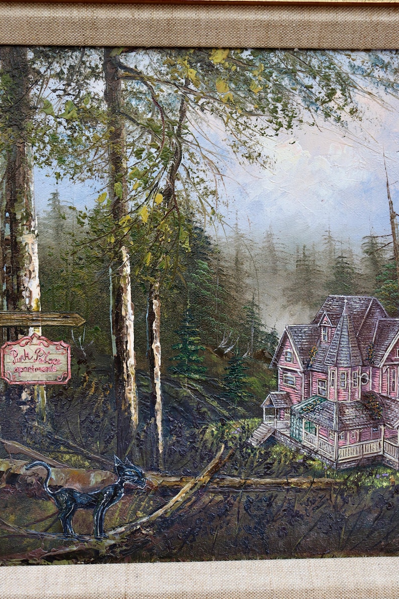 May include: Oil painting of a pink Victorian house in a forest setting. A black cat is perched on a fallen log in the foreground. A sign reads "Pink Palace Apartments". The painting has a textured, impressionistic style.