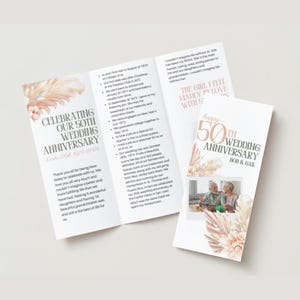 May include: A folded card with a photo of an older couple celebrating their 50th wedding anniversary. The card has a pink and brown floral design with the text "Celebrating our 50th Wedding Anniversary" and "Happy 50th Wedding Anniversary Bob & Gail".