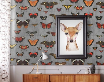 May include: A nursery room with a rocking horse, a rug, a plant, and a framed print of a deer. The walls are covered in wallpaper with a pattern of butterflies.