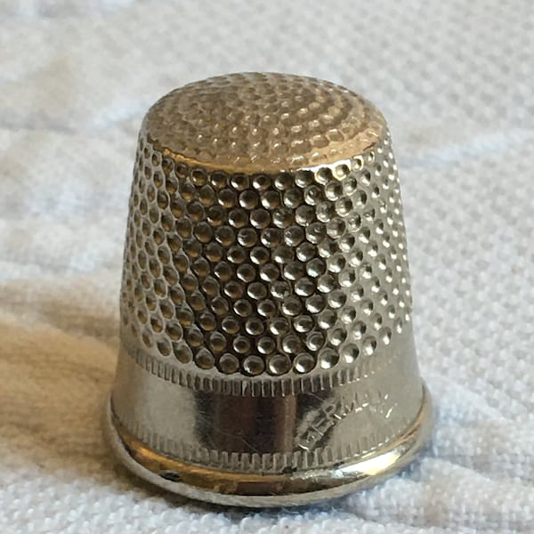 Vintage Germany Thimble. A Good Old Vintage Thimble. Center of the Top is Raised a Little. Listing for One Thimble.