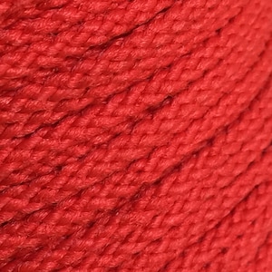 May include: Close-up of a red braided rope. The rope is made of tightly woven strands of red thread.