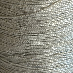 Vintage Metallic Silver Very Narrow Cord. Great for Ornament Hanging. Sold in 5 Yard Lengths. Great for Crafting. Many Purposes.