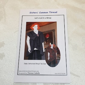 May include: A sewing pattern for a simple, unstructured wrap in two sizes. The pattern is called "Let's Call It a Wrap" and is designed by Yvonne Cabella. The pattern is available on the website sisterscommonthread.com. The item number is SCT10146.