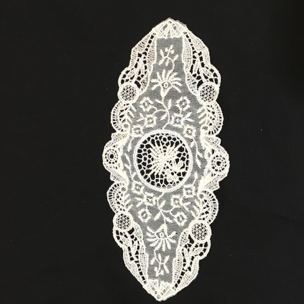 Vintage Creamy White Net Lace Applique Motif. Flowers and Vines on Net with Swirling and Circular Designs on Edge.