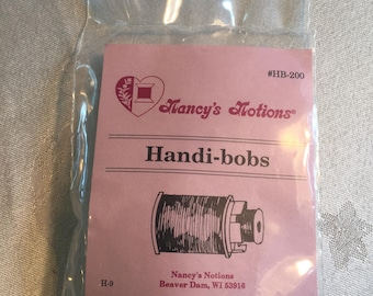 Vintage Nancy's Notions Handi-bobs. Bobbin Holder That Mounts onto One End of Your Thread Spool. Matches Tread and Bobbin of Same Color.