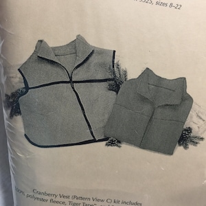 May include: A kit for making a cranberry vest. The kit includes 100% polyester fleece and Tiger Tape. The pattern is View C.