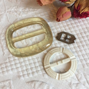 Vintage 1950s Plastic Buckles Plus Small Metal Buckle. Great for a Scarf or Sash. Light Yellow Clear Celluloid and White Textured Buckle.
